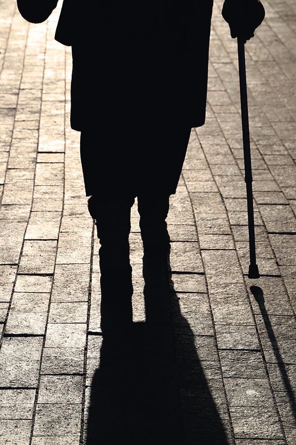 Girl and woman with a cane, black silhouettes and shadows of two people walking on the street. Concept of limping, old age, elderly or blind person